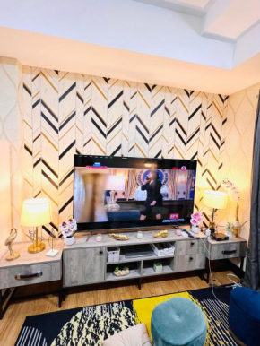 New Cozy 2 bedroom unit condotel for staycation with living room and kitchen set with pool